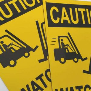 Yellow safety sign showing caution watch for forklift truck