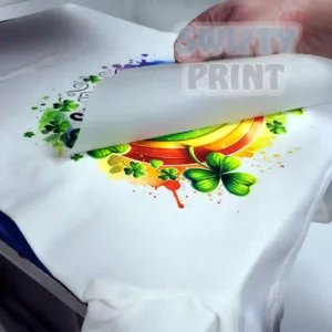 White tee with Rainbow DTF print being printed by Swifty Print